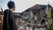 A local stands near houses damaged after earthquake hit in Cianjur, West Java province, Indonesia A local stands near houses damaged after earthquake hit in Cianjur, West Java province, Indonesia