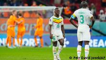 Senegal's Nampalys Mendy, center, reacts after loosing 0-2 at the end of the World Cup, group A soccer match between Senegal and Netherlands at the Al Thumama Stadium in Doha, Qatar, Monday, Nov. 21, 2022. (AP Photo/Petr David Josek)