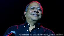 FILE - Cuban singer Pablo Milanes performs during a concert in Buenos Aires, Argentina, Wednesday Oct. 6, 2004. MilanÃ©s, the Latin Grammy-winning balladeer who helped found Cubaâ€™s â€œnueva trovaâ€ movement and toured the world as a cultural ambassador for Fidel Castroâ€™s revolution, died early Tuesday, Nov. 22, 2022, in Spain, where he had been under treatment for blood cancer. He was 79. (AP Photo/Natacha Pisarenko, File)