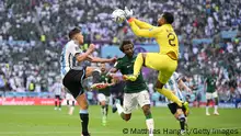 LUSAIL CITY, QATAR - NOVEMBER 22: Mohammed Al-Owais (R) of Saudi Arabia collides with teammate Yasser Al-Shahrani during the FIFA World Cup Qatar 2022 Group C match between Argentina and Saudi Arabia at Lusail Stadium on November 22, 2022 in Lusail City, Qatar. (Photo by Matthias Hangst/Getty Images)