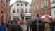 Burnt-out house with police and bystanders Burnt-out house with police and bystanders