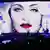Video of Madonna behind a stage.