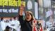 A woman holds up a poster and shouts with her hand raised at a protest in Delhi in 2022 A woman holds up a poster and shouts with her hand raised at a protest in Delhi in 2022