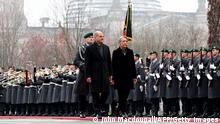 German Chancellor Olaf Scholz and French Prime Minister Elisabeth Borne inspect a military honor guard during a welcoming ceremony in front of the Chancellery in Berlin on November 25, 2022 (in background can be seen the cupola of the Reichstag building that houses the Bundestag, lower house of parliament). (Photo by John MACDOUGALL / AFP) (Photo by JOHN MACDOUGALL/AFP via Getty Images)