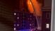 A screen shot of firefighters at night spraying water A screen shot of firefighters at night spraying water
