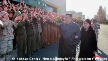 This undated photo provided on Nov. 27, 2022, by the North Korean government shows North Korean leader Kim Jong Un, center, and his daughter, right, wave to the soldiers who were involved in what it called the test-launch of its Hwasong-17 ICBM, at an unidentified location in North Korea. Independent journalists were not given access to cover the event depicted in this image distributed by the North Korean government. The content of this image is as provided and cannot be independently verified. Korean language watermark on image as provided by source reads: KCNA which is the abbreviation for Korean Central News Agency. (Korean Central News Agency/Korea News Service via AP)