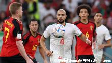 TOPSHOT - Belgium's midfielder #07 Kevin De Bruyne (L) and Morocco's midfielder #04 Sofyan Amrabat fight for the ball during the Qatar 2022 World Cup Group F football match between Belgium and Morocco at the Al-Thumama Stadium in Doha on November 27, 2022. (Photo by Fadel Senna / AFP) (Photo by FADEL SENNA/AFP via Getty Images)