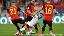 Morocco's midfielder #15 Selim Amallah (C) fights for the ball with Belgium's defender #21 Timothy Castagne, Belgium's midfielder #06 Axel Witsel and Belgium's midfielder #16 Thorgan Hazard during the Qatar 2022 World Cup Group F football match between Belgium and Morocco at the Al-Thumama Stadium in Doha on November 27, 2022. (Photo by MANAN VATSYAYANA / AFP) (Photo by MANAN VATSYAYANA/AFP via Getty Images)
