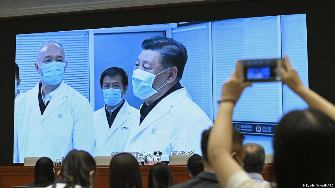 Journalists watch a screen showing President Xi Jinping in Beijing, China, on June 7, 2020