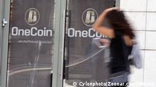 OneCoin cryptocurrency Sofia, Bulgaria - 12 May, 2019: A woman passes by the office of OneCoin cryptocurrency founded by Ruja Ignatova. Copyright: xZoonar.com/Cylonphotox zoonar_14233830