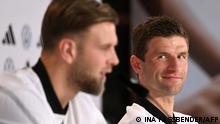 Germany's forward Thomas Mueller (R) and Germany's forward Niclas Fuellkrug (L) attend a press conference at the Al Shamal Stadium in Al Shamal, north of Doha on November 29, 2022, during the Qatar 2022 World Cup football tournament. (Photo by INA FASSBENDER / AFP)