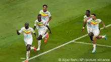 Senegal's Kalidou Koulibaly, left, celebrates after scoring during the World Cup group A soccer match between Ecuador and Senegal, at the Khalifa International Stadium in Doha, Qatar, Tuesday, Nov. 29, 2022. (AP Photo/Aijaz Rahi)