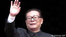 (FILES) In this file photo taken on October 1, 1999, Chinese President Jiang Zemin waves during the National Day parade in Beijing's Tiananmen Square celebrating the 50th anniversary of the People's Republic of China. - China's former leader Jiang Zemin, who steered the country through a transformational era from the late 1980s and into the new millennium, died November 30, 2022 at the age of 96, Xinhua reported. (Photo by XINHUA / AFP) / - China OUT