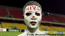 ACCRA, GHANA - FEBRUARY 10: A boy poses, painted with AIDS warnings, during the AFCON final between Cameroon and Egypt held at the Ohene Djan Stadium on February 10, 2008 in Accra, Ghana. (Photo by Lefty Shivambu/Gallo Images/Getty Images)