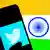 A Twitter logo is displayed on a smartphone with an Indian flag in the background