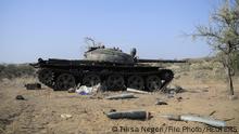 FILE PHOTO: Ammunition is seen next to a tank destroyed in a fight between the Ethiopian National Defence Force (ENDF) and the Tigray People's Liberation Front (TPLF) forces in Kasagita town, Afar region, Ethiopia, February 25, 2022. Picture taken February 25, 2022.REUTERS/Tiksa Negeri/File Photo