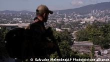 A soldier takes part in an operation in search of gang members, in Soyapango, El Salvador, Saturday, Dec. 3, 2022. The government of El Salvador sent 10,000 soldiers and police to seal off Soyapango, on the outskirts of the nationâ€™s capital Saturday. (AP Photo/Salvador Melendez)
