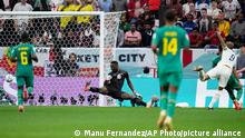 England's Harry Kane, right, scores his side's second goal during the World Cup round of 16 soccer match between England and Senegal, at the Al Bayt Stadium in Al Khor, Qatar, Sunday, Dec. 4, 2022. (AP Photo/Manu Fernandez)