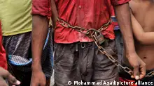 A minor caught stealing some small steel, is fastened with chains and escorted around the city of Dhaka. Minor thieves are now becoming a disturbance in Dhaka. (Photo by Mohammad Asad/Pacific Press)
