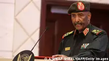 Sudan's Army chief Abdel Fattah al-Burhan speaks following the signature of an initial deal aimed at ending a deep crisis caused by last year's military coup, in the capital Khartoum on December 5, 2022. - The past year has seen near-weekly protests and a crackdown that pro-democracy medics say has killed at least 121, a spiralling economic crisis exacerbated by donors slashing funding, and a resurgence of ethnic violence in several remote regions. Divisions among civilian groups have deepened since the coup, with some urging a deal with the military while others insist on no partnership, no negotiation. (Photo by ASHRAF SHAZLY / AFP) (Photo by ASHRAF SHAZLY/AFP via Getty Images)