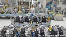 YANTAI, CHINA - NOVEMBER 17, 2022 - Workers make auto parts on a production line at SAIC-GM Dongyue Automobile Co in Yantai, East China's Shandong province, Nov 17, 2022. China's purchasing Managers' Index (PMI) for November was released by the National Bureau of Statistics. In November, the manufacturing PMI fell to 48.0%, below the critical point for two consecutive months, indicating greater downward pressure on the manufacturing sector.
