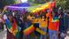 People hold a rainbow flag at an LGBTQ parade in India People hold a rainbow flag at an LGBTQ parade in India