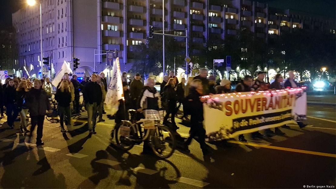 Protesters against COVID restrictionsbearing Reichsbürger banners at demonstration in Berlin in November 2022