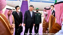 Chinese President Xi Jinping, center, greets by Prince Faisal bin Bandar bin Abdulaziz, Governor of Riyadh, after his arrival in Riyadh, Saudi Arabia, Wednesday, Dec. 7, 2022. (Saudi Press Agency via AP)