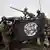 Nigeria Zwangsabtreibungen, Soldaten mit Boko Haram Flagge