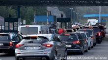 MACELJ, CROATIA - AUGUST 22: Vehicles, some from Austria, Slovenia and Germany, queue at the Macelj border crossing between Croatia and Slovenia, as many tourists take heed of a recommendation from their home country and leaving Croatia as the number of coronavirus (Covid-19) infections rose to 306 on August 22, 2020. News reported that Croatia could be next on UK and European countries' quarantine list. Stipe Majic / Anadolu Agency