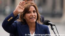 Peru's new President Dina Boluarte waves after making a statement at the government palace in Lima, Peru, Thursday, Dec. 8, 2022. Peru's Congress voted to remove President Pedro Castillo from office Wednesday and replace him with the vice president, Boluarte, shortly after Castillo tried to dissolve the legislature ahead of a scheduled vote to remove him. (AP Photo/Fernando Vergara)