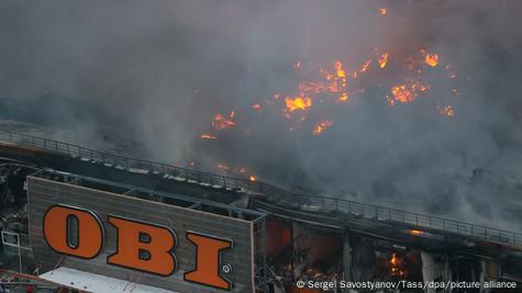 Firefighters battle a fire that hit a hypermarket of the OBI home improvement and gardening retailer at the Mega Khimki shopping mall