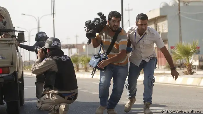 Journalists are seen as the security forces clash with Daesh terrorists in Domiz district of Kirkuk, Iraq on October 22, 2016. Street-to-street fighting between Daesh militants and security forces in Iraq?s northern city of Kirkuk took place on Saturday, a local source told. 