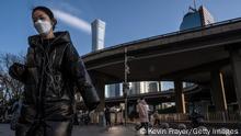 08.12.22 *** BEIJING, CHINA - DECEMBER 08: Communters walk to work during the morning rush hour as many companies are still operating at limited capacity, on December 8, 2022 in Beijing, China. As part of a 10 point directive, Chinas government announced Wednesday that people with COVID-19 who have mild or no symptoms will be permitted to quarantine at home instead of at a government facility, testings requirements are reduced, people are permitted to buy over the counter medications, and local officials can no longer lock down entire neighbourhoods or cities, a major shift in its zero COVID policy. (Photo by Kevin Frayer/Getty Images)