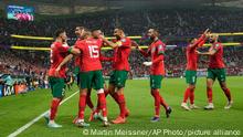 Morocco's Youssef En-Nesyri celebrates after scoring his side's first goal during the World Cup quarterfinal soccer match between Morocco and Portugal, at Al Thumama Stadium in Doha, Qatar, Saturday, Dec. 10, 2022. (AP Photo/Martin Meissner)