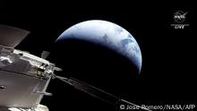 In this still image taken from NASA TV, NASA's unmanned Orion spaceship approaches Earth as it returns from its Moon mission, on December 11, 2022. - Orion was launched November 16 on the Artemis rocket for a 25-day mission to the Moon. (Photo by Jose ROMERO / NASA TV / AFP) / RESTRICTED TO EDITORIAL USE - MANDATORY CREDIT AFP PHOTO / NASA TV - NO MARKETING NO ADVERTISING CAMPAIGNS - DISTRIBUTED AS A SERVICE TO CLIENTS