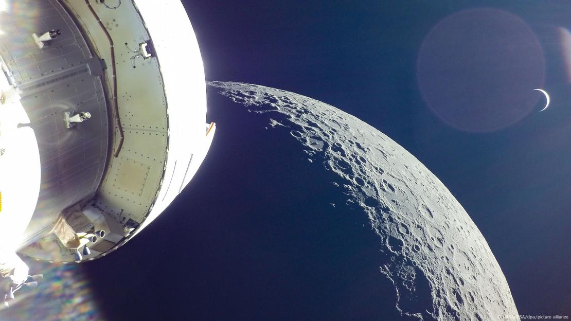 The moon and planet Earth as seen from an Orion capsule, part of the Artemis space program