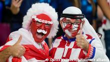 Croatia and Canada fans cheer ahead of the World Cup group F soccer match between Croatia and Canada, at the Khalifa International Stadium in Doha, Qatar, Sunday, Nov. 27, 2022. (AP Photo/Darko Vojinovic)