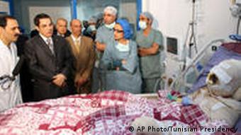 Former Tunisian President Ben Ali visiting Bouazizi in the hospital