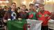 Algerian and Moroccan fans posing with an Algerian flag in Souq Waqif in Doha Algerian and Moroccan fans posing with an Algerian flag in Souq Waqif in Doha