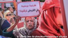 An elderly woman hold a sign that reads in Arabic, you have impoverished us, starved us, drowned us in debts, during a protest march held by the Free Constitutional Party: PDL (French: Le Parti Destourien Libre), on the occasion of the 59th anniversary of the Evacuation Day, in Tunis, Tunisia, on October 15, 2022, to protest over the economic and social crisis, the price increases, the rising cost of living, the rise in inflation, and generally against the economic and social policy of the Tunisian president Kais Saied. (Photo by Chedly Ben Ibrahim/NurPhoto)