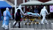 Medical staff moves a patient into a fever clinic at Chaoyang Hospital in Beijing, China December 13, 2022, in this screen grab taken from a Reuters TV video. REUTERS TV via REUTERS