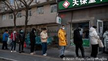 BEIJING, CHINA - DECEMBER 09: People wait in line to buy medicine at a pharmacy on December 9, 2022 in Beijing, China. As part of a 10 point directive, Chinas government announced Wednesday that people with COVID-19 who have mild or no symptoms will be permitted to quarantine at home instead of at a government facility, testings requirements are reduced, people are permitted to buy over the counter medications, and local officials can no longer lock down entire neighbourhoods or cities, a major shift in its zero COVID policy. (Photo by Kevin Frayer/Getty Images)
