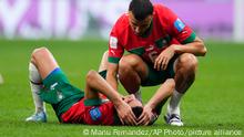 Morocco's Romain Saiss consoles Achraf Hakimi at the end of the World Cup semifinal soccer match between France and Morocco at the Al Bayt Stadium in Al Khor, Qatar, Wednesday, Dec. 14, 2022. France won 2-0 and will play Argentina in Sunday's final. (AP Photo/Manu Fernandez)