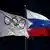 A bandeira do Comitê Olímpico Internacional com as cinco argolas coloridas tremula ao lado da bandeira da Rússia.