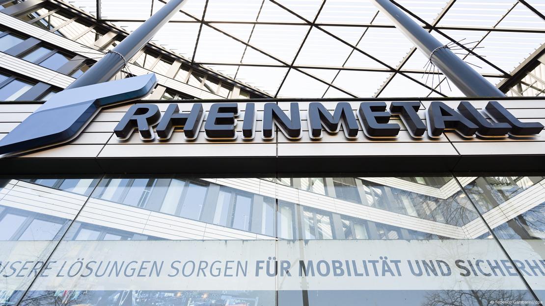 Large glass building, sign that reads Rheinmetall.