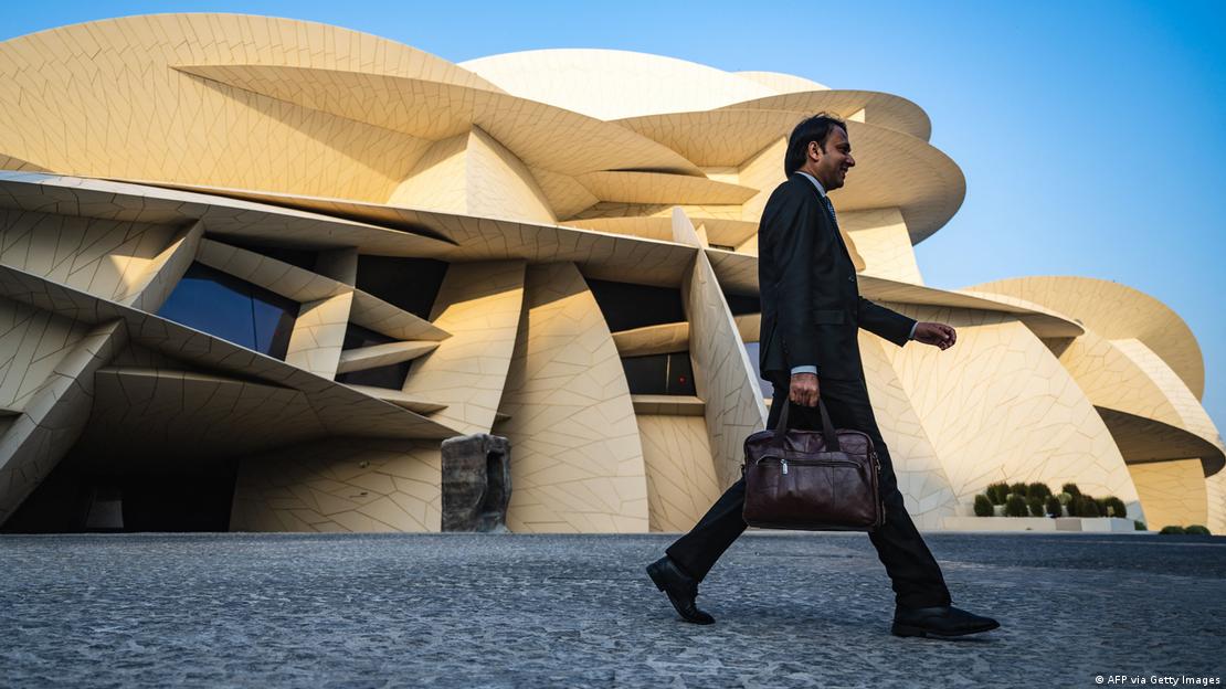 A man walks past the National Museum of Qatar building on November 13, 2022, ahead of the Qatar 2022 World Cup football tournament.