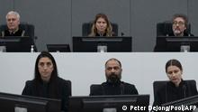 Presiding judge Mappie Veldt-Foglia (Top row, C), prepares to read the verdict in the case of Salih Mustafa, a former Commander of a BIA guerilla unit, which operated within the Llap Operational Zone of the Kosovo Liberation Army (KLA), waits in the Kosovo Specialist Chambers court for the judges to read the verdict, in The Hague, on December 16, 2022. - A special Kosovo court in The Hague convicted former rebel commander Salih Mustafa on December 16, 2022 of murder and torture and jailed him for 26 years in its first war crimes verdict. (Photo by Peter Dejong / POOL / AFP) / Netherlands OUT
