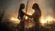Film still from 'Avatar: The Way Of Water': Two figures look at each other, a burning landscape in the background. Film still from 'Avatar: The Way Of Water': Two figures look at each other, a burning landscape in the background.