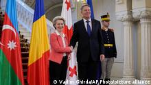 European Commission President Ursula von der Leyen shakes hands with Romanian President Klaus Iohannis at the Cotroceni presidential palace in Bucharest, Romania, Saturday, Dec. 17, 2022. The leaders of Hungary, Romania, Georgia and Azerbaijan met in Romania's capital to conclude an agreement on an undersea electricity connector that could become a new power source for the European Union amid a crunch on energy supplies caused by the war in Ukraine. (AP Photo/Vadim Ghirda)
